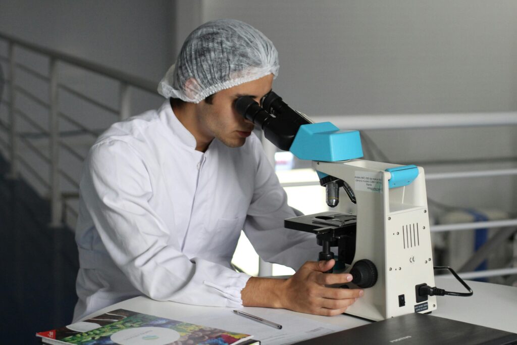 science, man lab experiment, microscope, ZMA